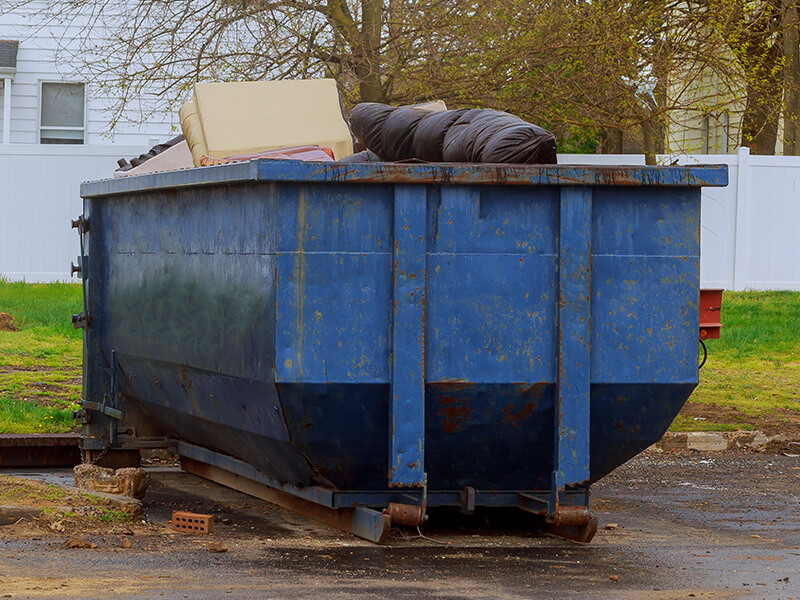 Overfilled County Waste Dumpster